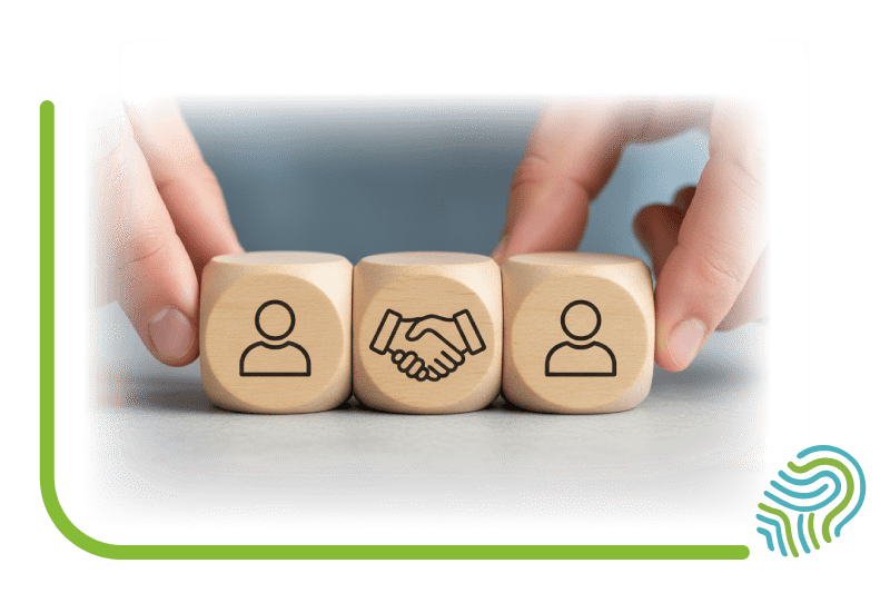 Partner-Netzwerk von Energy for Health | Ärzte & Therapeuten Hände arrangieren Holzwürfel mit Symbolen für Personen und einen Händedruck, was das starke Partner-Netzwerk von Energy for Health mit Ärzten, Therapeuten und Ernährungswissenschaftlern darstellt.<br />
